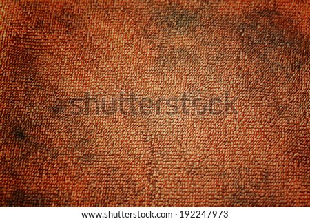 Pattern of dark orange fabric for the background.