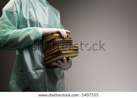 Doctor carrying old books