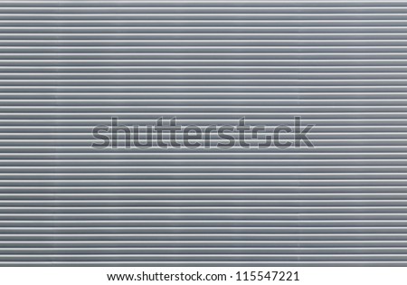 Striped metal shutters. Close-up. Texture. Horizontal lines.