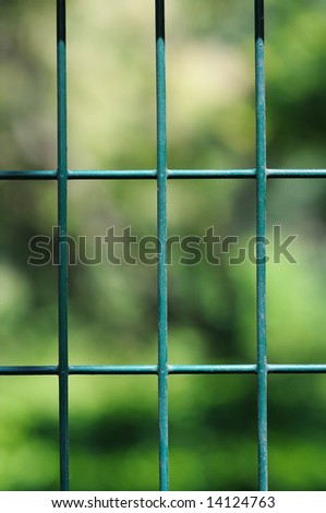 Green metal grille in the park.