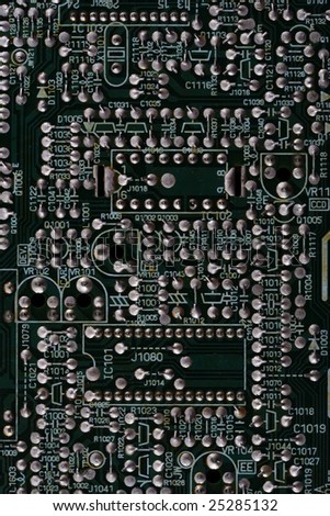Close-up of microcircuit board. Old an dirty. Texture. Dark green color.