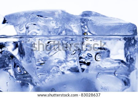 Ice cubes in the glass of water.