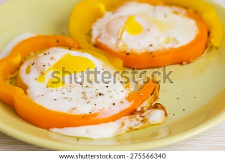 Scrambled eggs fried in the ring of sweet pepper.