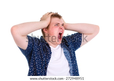 Closeup portrait of angry, frustrated young man, pulling his hair out, isolated on white background. Negative emotions