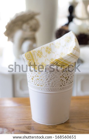 white vase on wooden table indoors, tissue