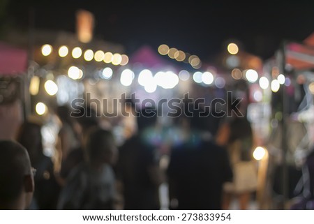 Blurred background : image of blurred background night market on street decorated with festive lights.