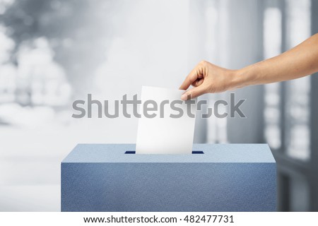 Ballot box with person vote on blank voting slip. bright interior background. voting concept.