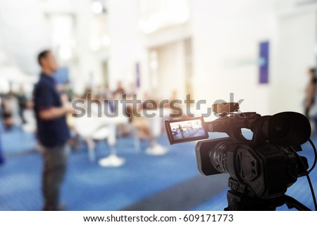 Video camera taking live video streaming at event background