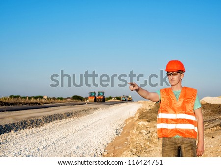 engineering construction company, building a new road construction in overalls