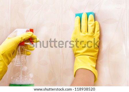 washing the tiles in the bathroom, cleaning kit apartment, hygienic cleaning,  gloves, sponge and cloth
