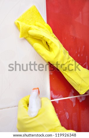 washing the tiles in the bathroom, cleaning kit apartment, hygienic cleaning,  gloves, sponge and cloth