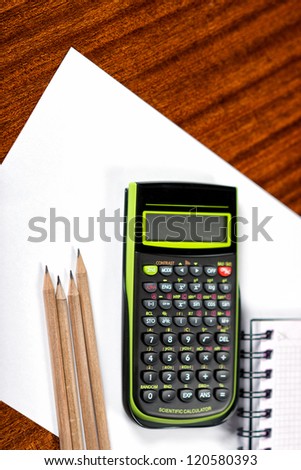 Financial planning with calculator and pencil, business plan.Stationery. Supplies for school.