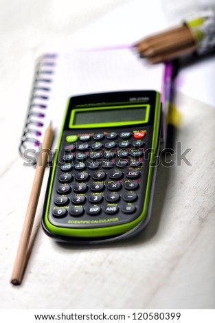 Financial planning with calculator and pencil, business plan. Stationery. Supplies for school.