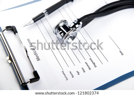medical records, stethoscope and writing pen on the white table