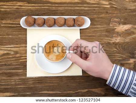 classic man drinks coffee with chocolates truffle