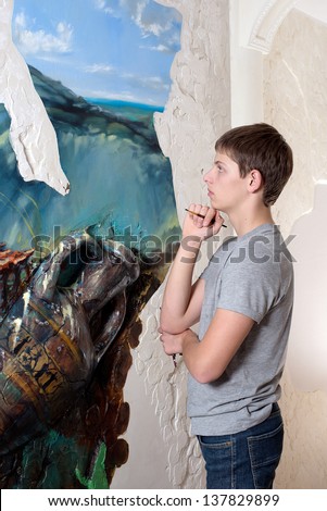 artist paints oil painting on the wall. oil painting on the wall.
