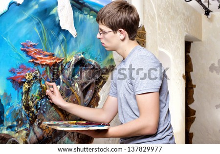 artist paints oil painting on the wall. oil painting on the wall.