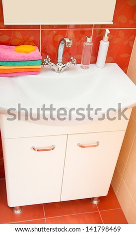 Towels and soap bathroom. .washing hands in bathroom.Wash basin with mixer tap and towels