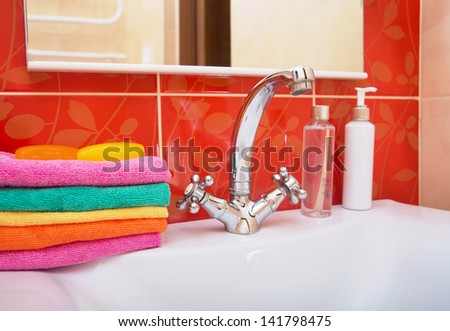 Towels and soap bathroom. .Washing hands in bathroom.Wash basin with mixer tap and towels