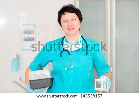 Woman doctor assistant. nurse holding a plastic test tube