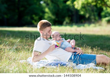 young father with baby on nature. outdoor recreation