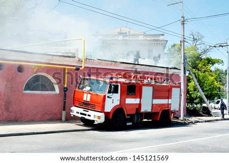 A fire in the street. fire truck