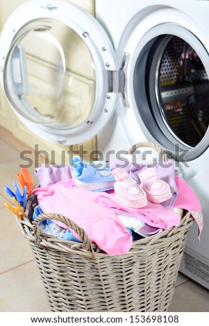 Laundry Basket and washing machine.children\'s clothes