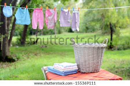 basket of laundry. Drying clothes outdoors