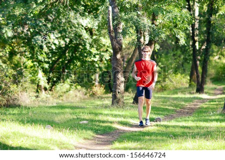 Sport - runner running.Sport man running. Runner sprinting training for marathon.