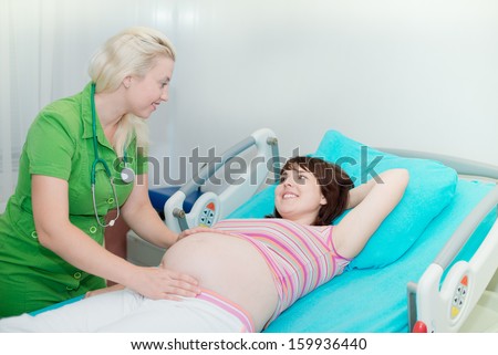 birth in hospital. The doctor takes birth. Pregnant woman in hospital