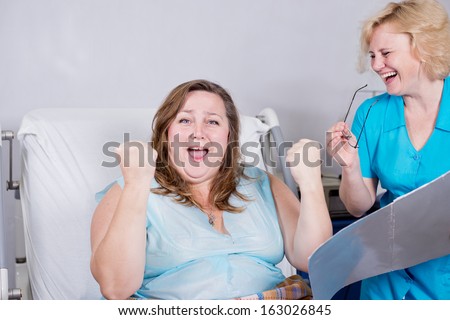 happy patient,  the doctor told the good news to the patient