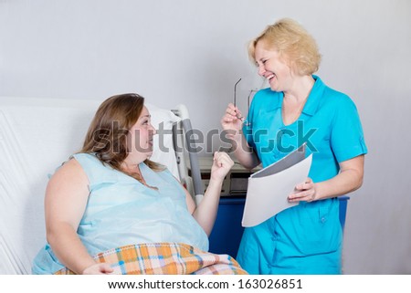 happy patient,  the doctor told the good news to the patient