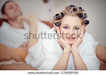 Man and woman lie on bed. cheerful beautiful couple