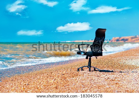 office chair on the ocean shore