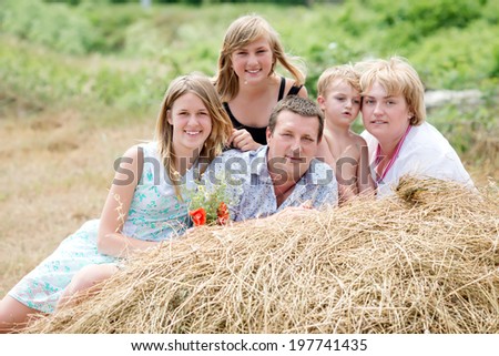 Happy family in nature. Family with many children in the manger