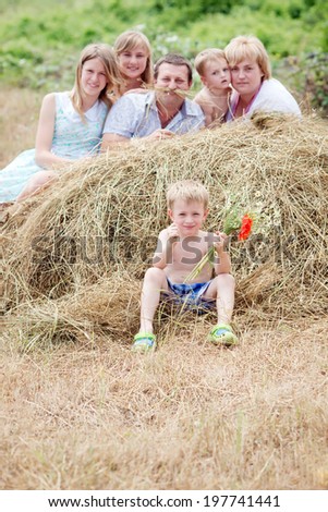 Happy family in nature. Family with many children in the manger