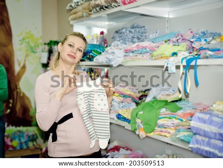 Cheerful Positive Female With Packs And Girl Buying Clothes In The