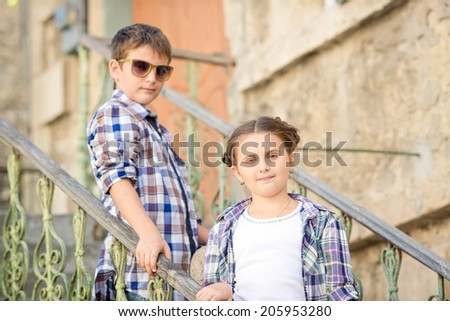 boy and girl outdoors. Brother and sister outdoors in city