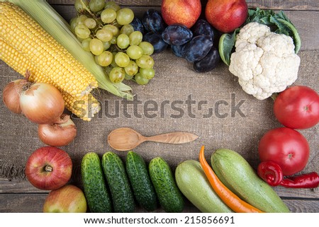 vegetables and fruits on wooden table. Healthy Organic Vegetables on a Wooden Background. Frame Design