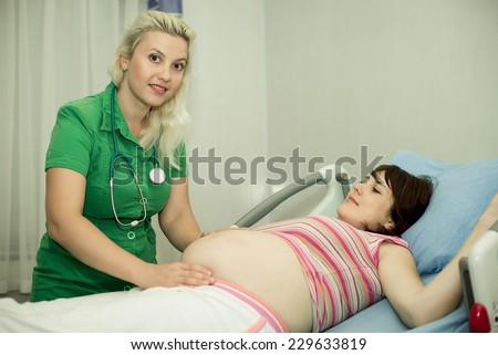 Pregnant woman in childbirth. pregnant woman on reception at the doctor...