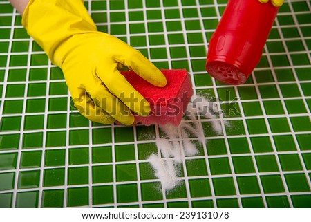 washing the tiles in the bathroom, cleaning kit apartment, hygienic cleaning, gloves, sponge and powder