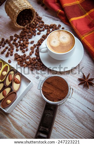 cup of coffee with chocolates. element coffee machines