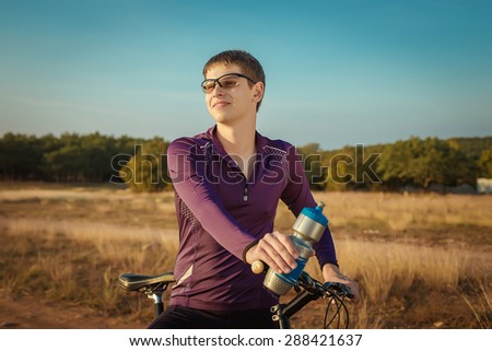 Happy cyclist in nature