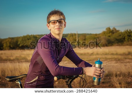 Happy cyclist in nature