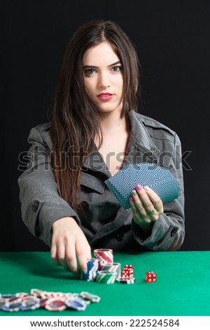 Beautiful lady playing Blackjack in casino