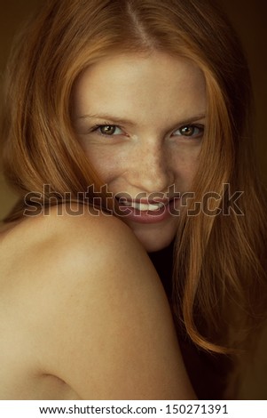 Emotive Portrait Of A Fashionable Model With Red (Ginger) Wavy Hair And Natural Make-Up. Great White Shiny Smile. Perfect Skin With Freckles. Retro Style. Close Up. Studio Shot