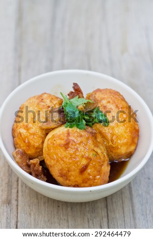 Egg with Tamarind sweet Sauce on wood table