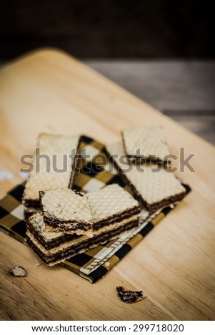 Layer Chocolate Wafers on fabric,still life food vintage tone