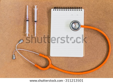 Stethoscope and textbook therapeutic Concept medical treatment