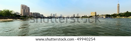 Water smooth surface of the Nile in the urban jungle